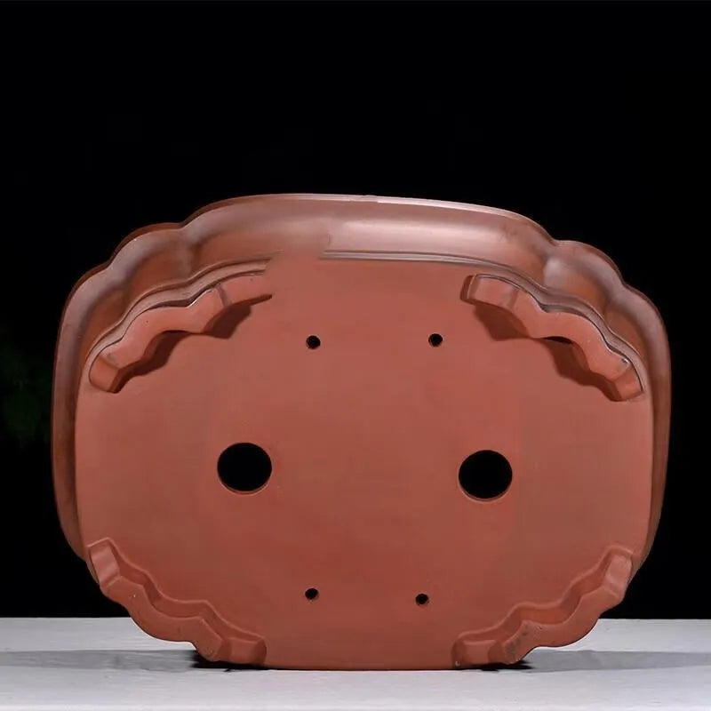 Large antique-style rectangular purple clay flowerpot for garden trees and plants.