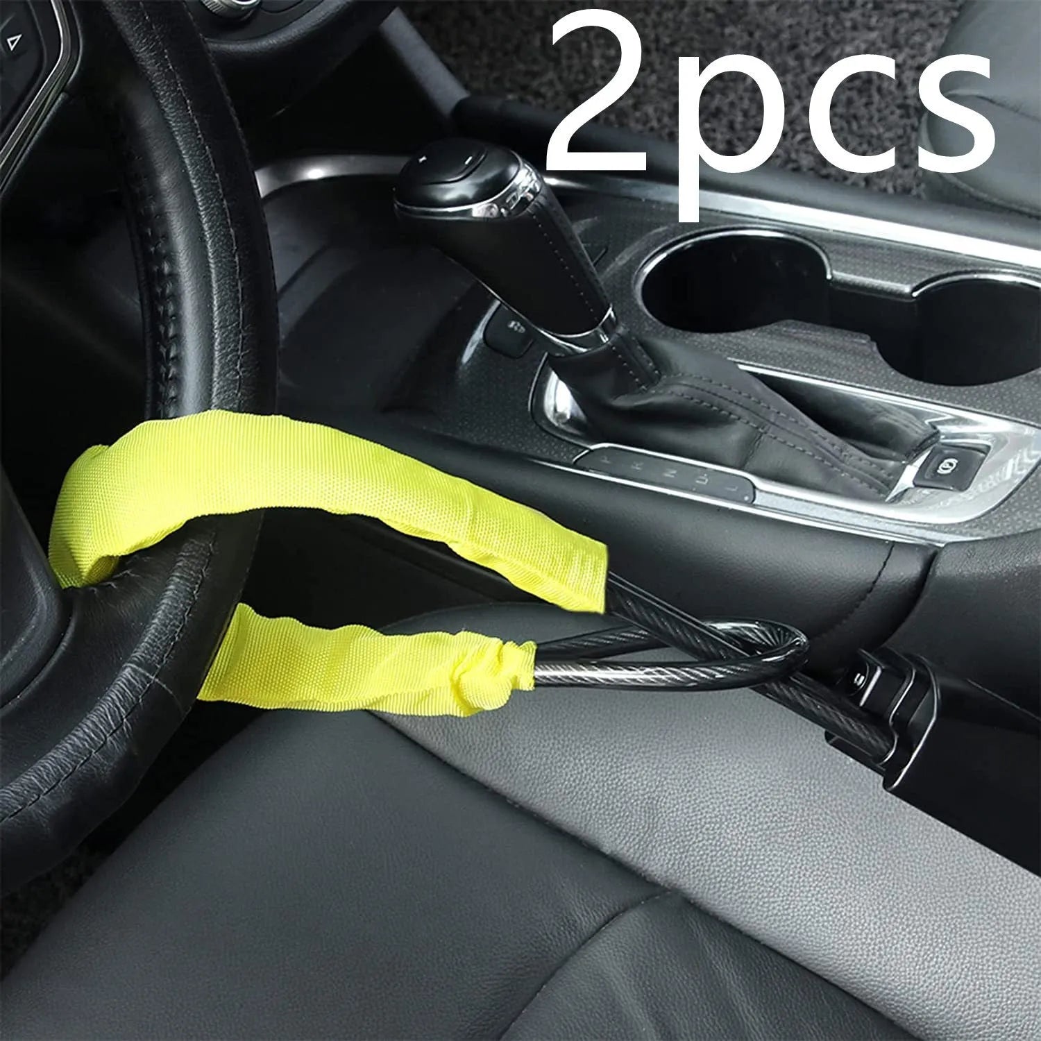 Red iron car steering wheel lock with copper core for General Motors vehicles on a steering wheel.