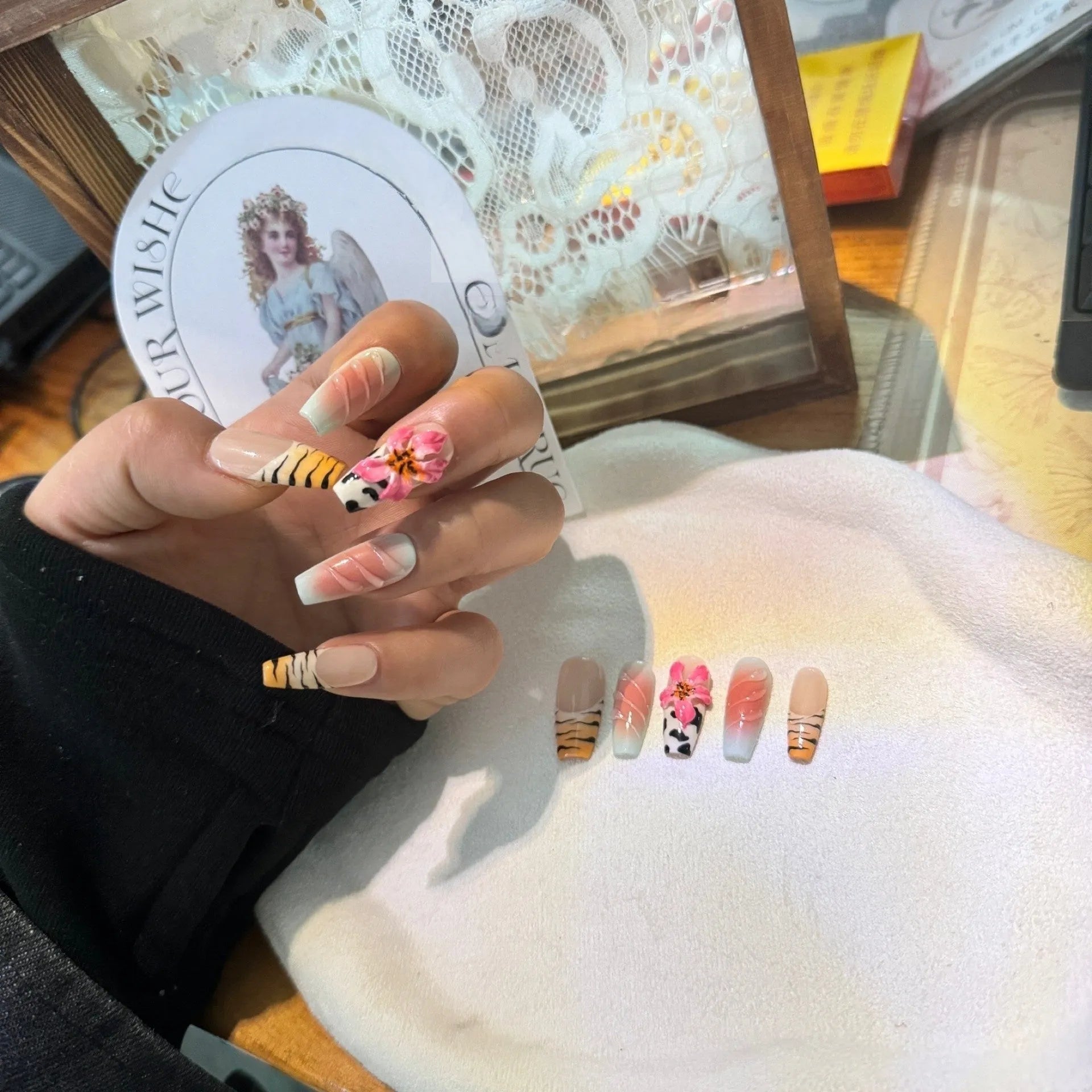 Zebra pattern lily hand carving nail art set showing embossed designs in multiple sizes