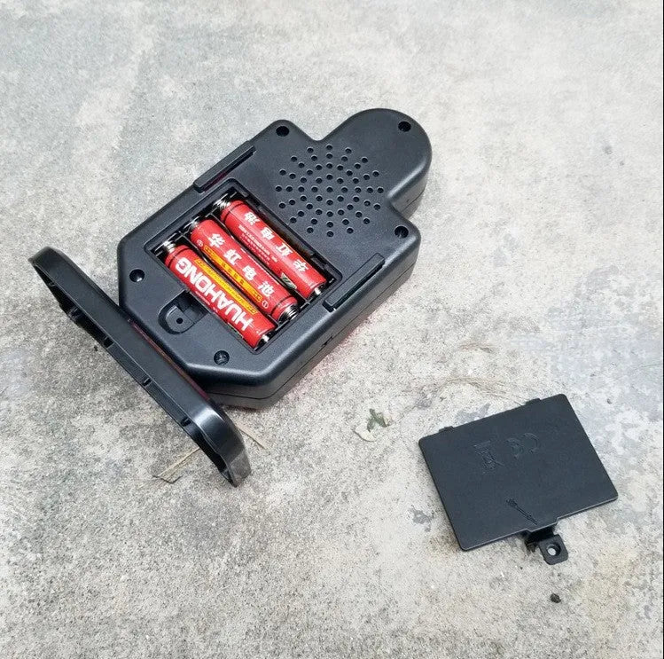 Laser target with light and sound effects in plastic casing, dimensions 9cm by 4.7cm by 12.8cm