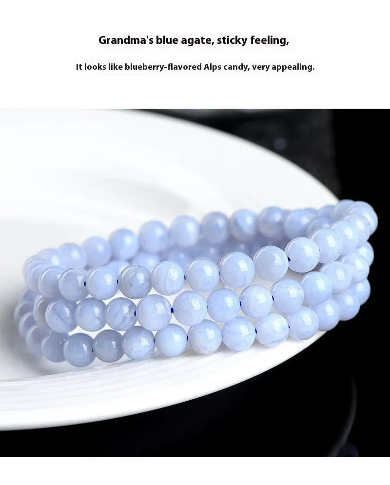 Blue agate beaded bracelet with Ruyi design elements and scattered striped beads