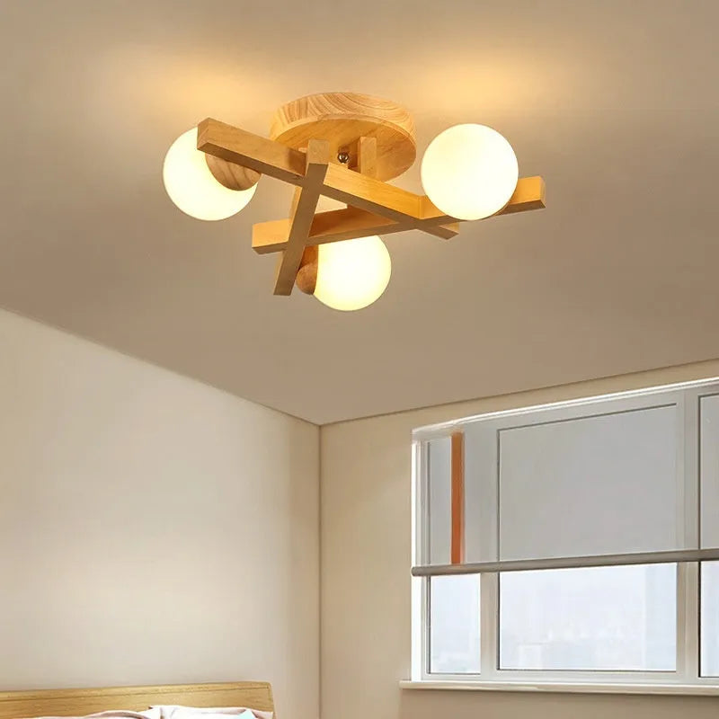 Nordic-style wooden effect ceiling light with three adjustable neutral white LED heads on angled arms.