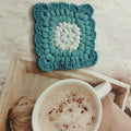 Crocheted grandmother lattice wool cup placemat coaster in emerald, sea salt blue, dream purple or fog brown.