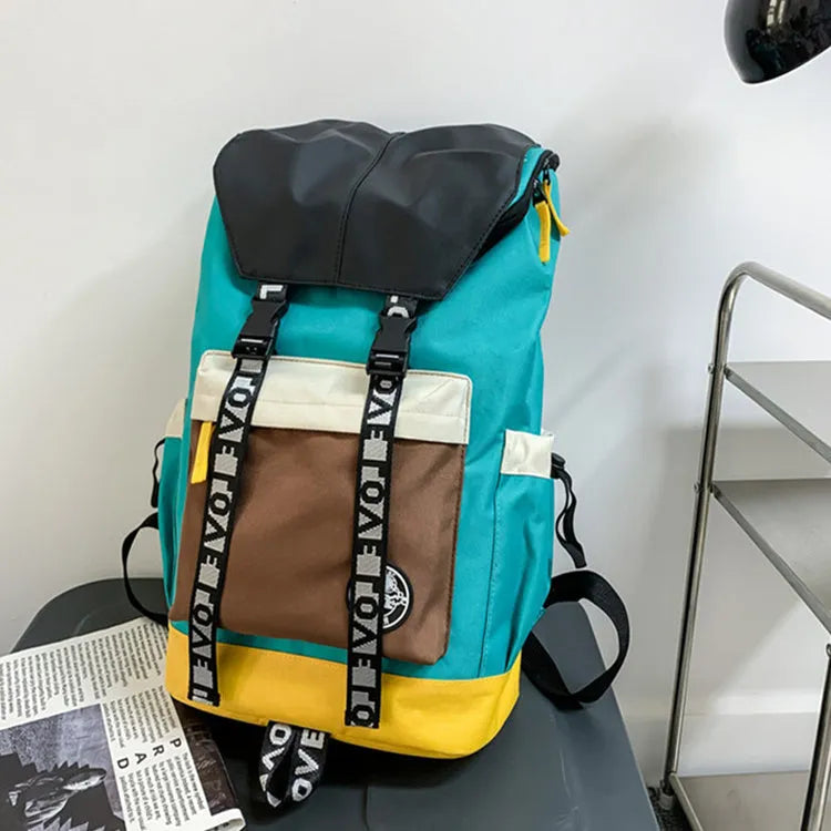 A mid-size black Oxford cloth backpack shown with handheld and two-shoulder carry options.