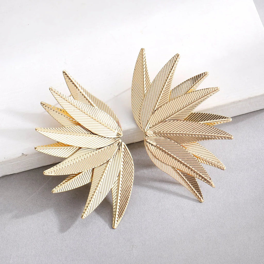 Gold and white alloy patch earrings with leaves shape design