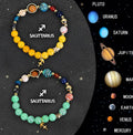 Set of two natural stone beaded bracelets with zodiac sign charms for astrology jewellery.