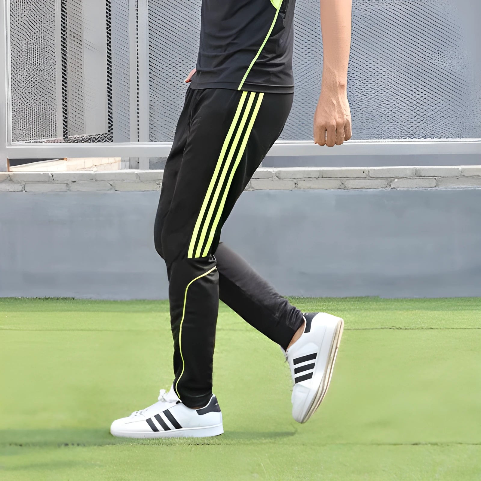 Men's straight tube polyester fast-dry fitness running trousers in fluorescent green with three solid side stripes