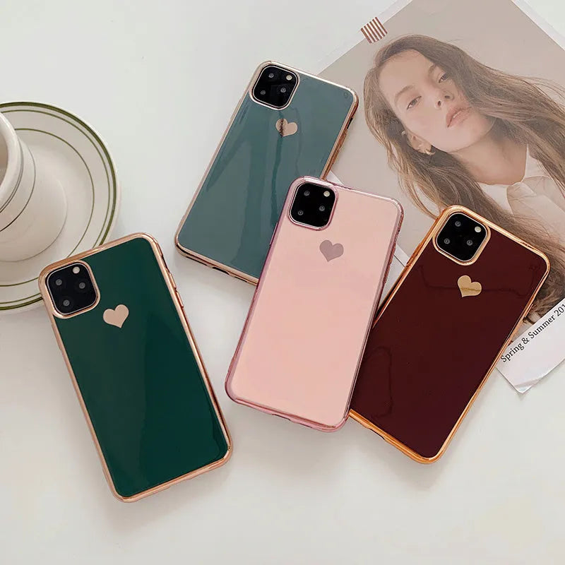 Luxury plating love solid colour TPU back cover case for iPhone on a table.