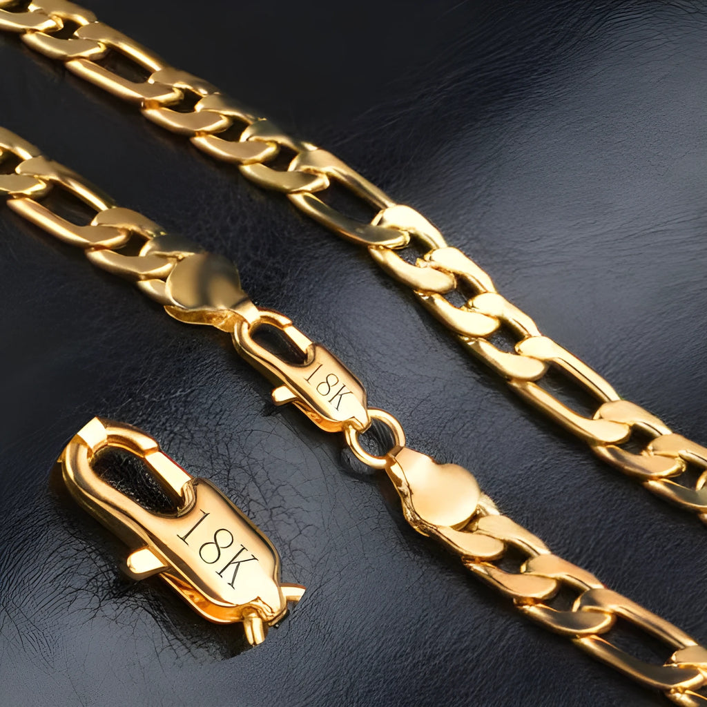 Silver and gold 3:1 chain necklace and bracelet set on a display stand