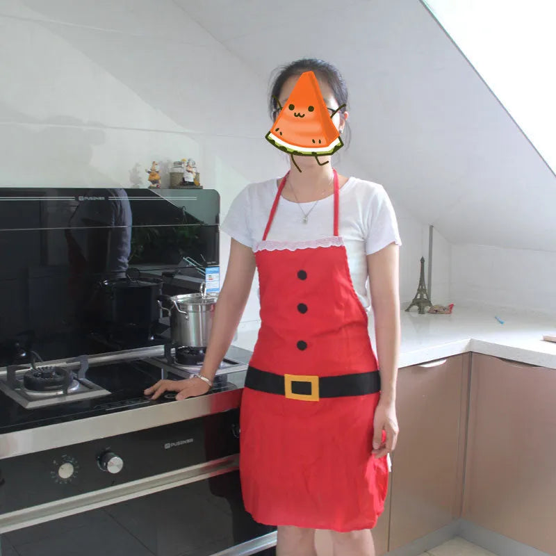 Red polyester Christmas apron shown in adult and children's sizes on a kitchen background