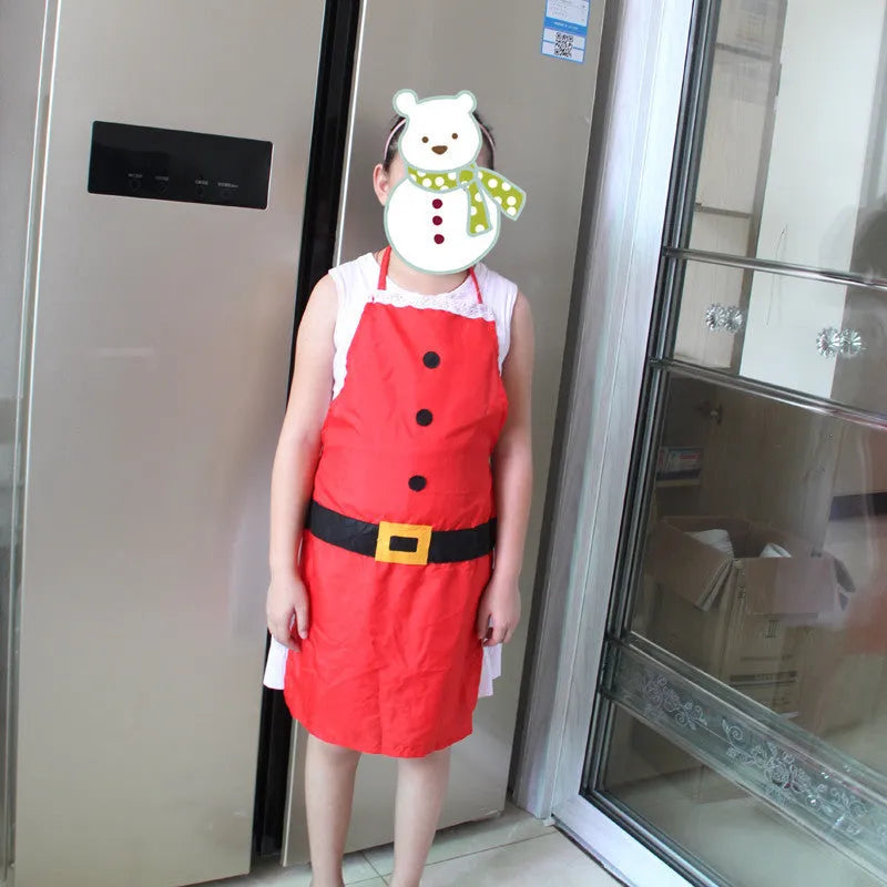 Red polyester Christmas apron shown in adult and children's sizes on a kitchen background