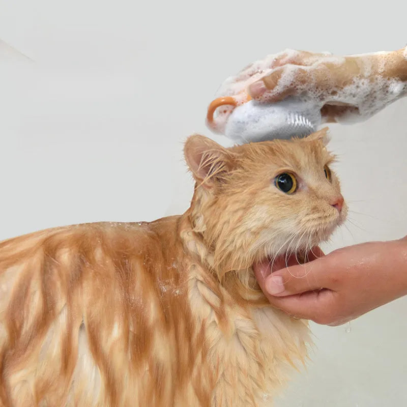 Orange TPR dog shampoo brush with silicone comb teeth and pumpkin-shaped ergonomic handle