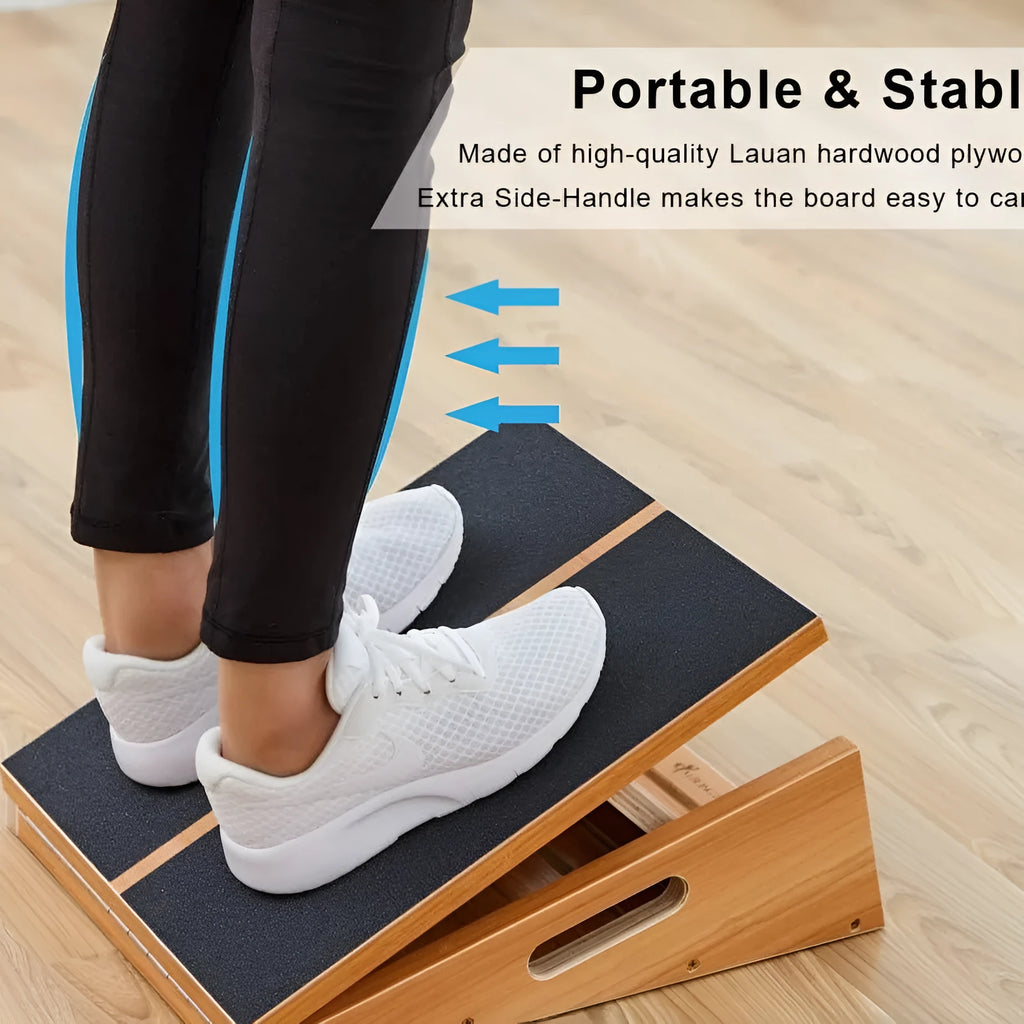 Wooden adjustable angle stretch board in wood colour on a gym floor