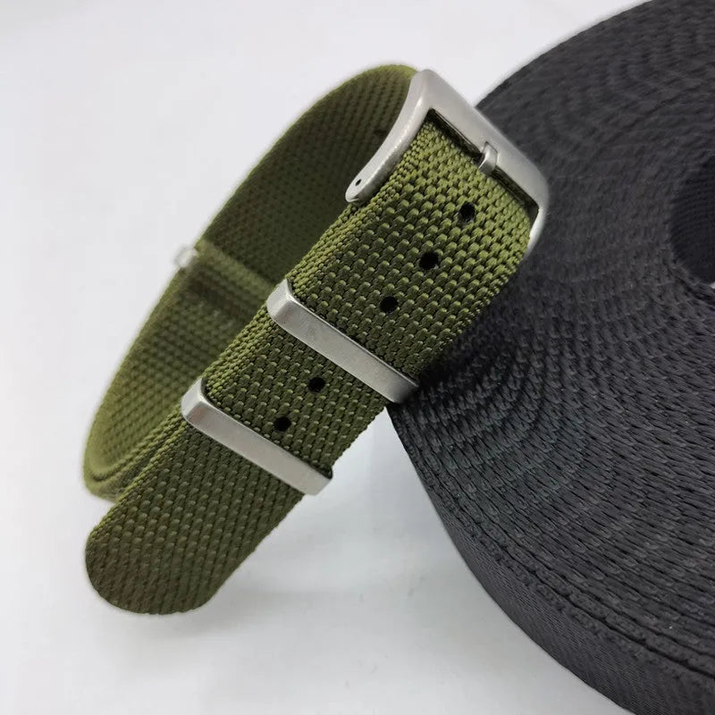 Nylon integrated watch strap in army green colour, showing the textile weave and buckle.