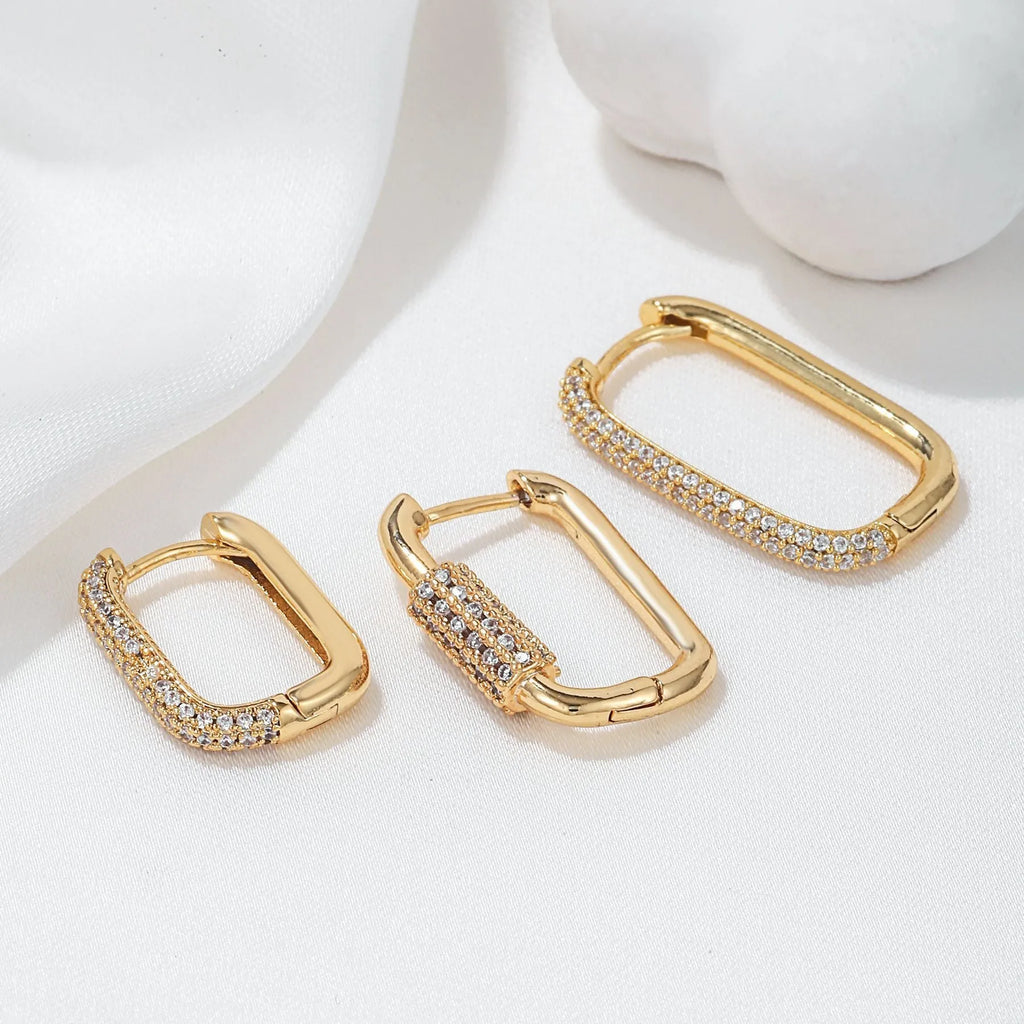 Geometric zircon ear clip set showing three square earrings with quadrilateral and ellipse designs
