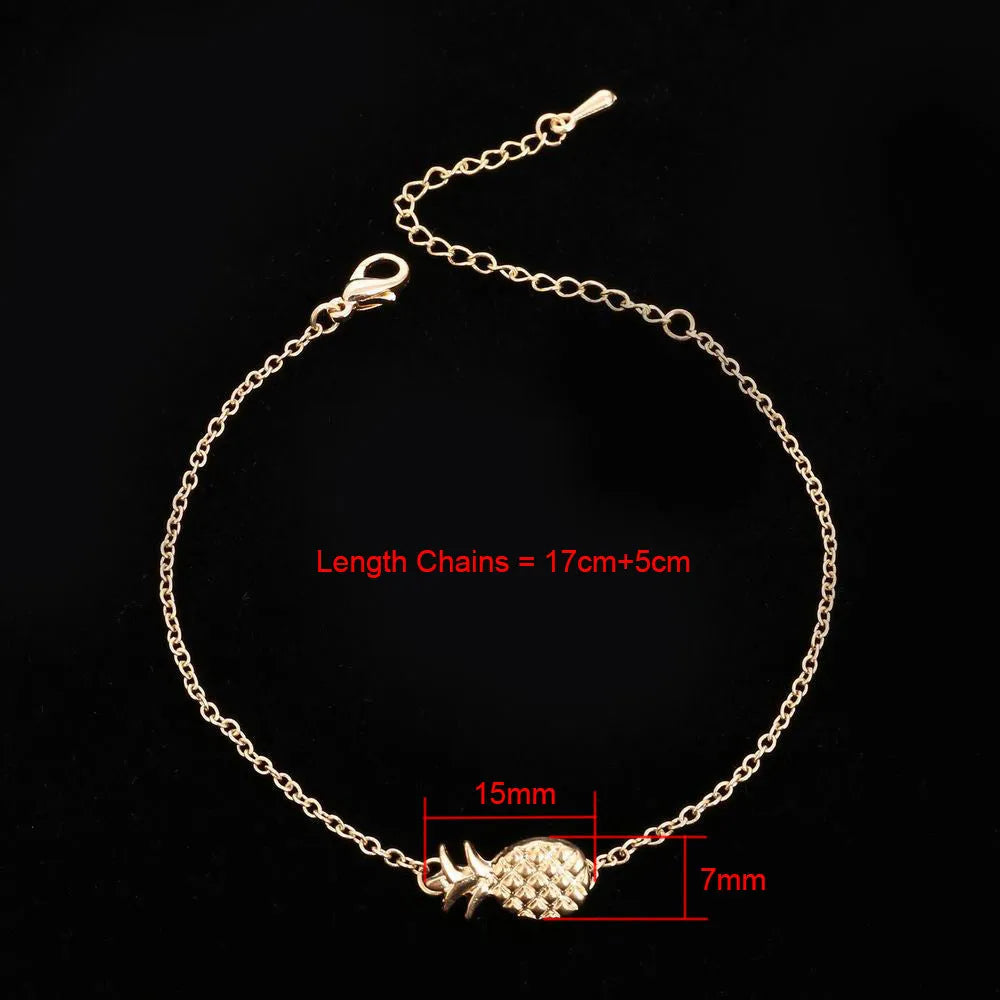 Gold or silver alloy bracelet featuring a pineapple charm, from the XINGX women's jewellery series.