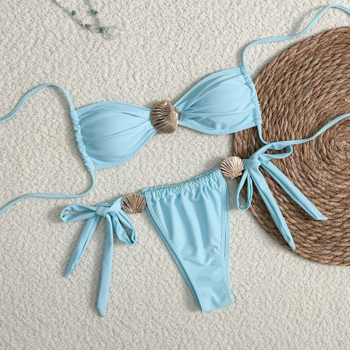 Blue women's high waist lace-up bikini swimsuit in polyester with metal shell detail on briefs