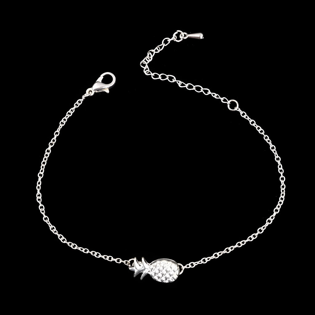 Gold or silver alloy bracelet featuring a pineapple charm, from the XINGX women's jewellery series.