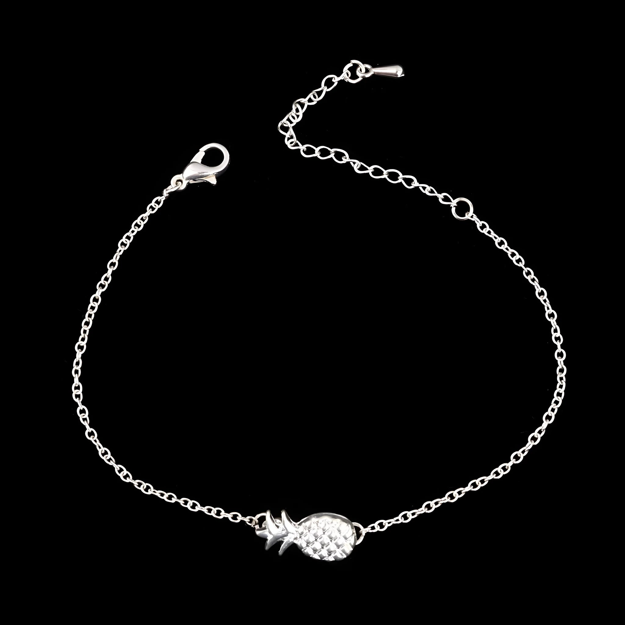 Gold or silver alloy bracelet featuring a pineapple charm, from the XINGX women's jewellery series.