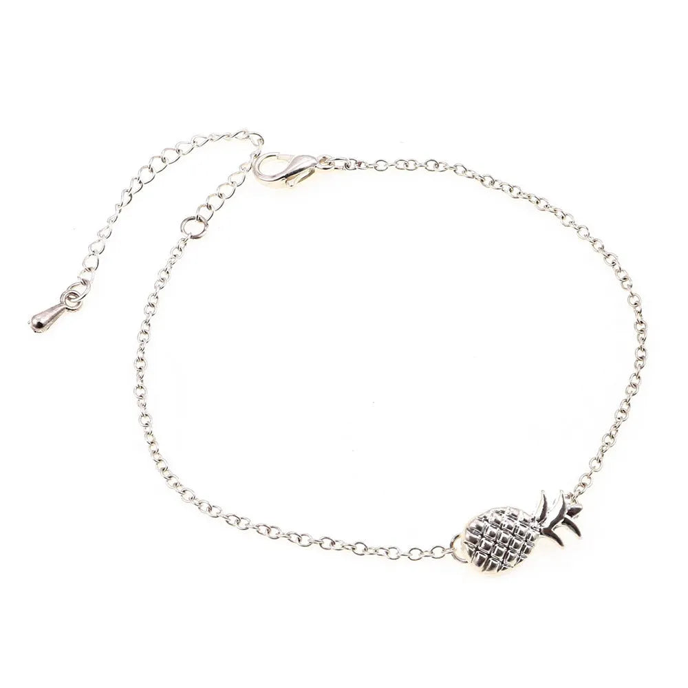 Gold or silver alloy bracelet featuring a pineapple charm, from the XINGX women's jewellery series.