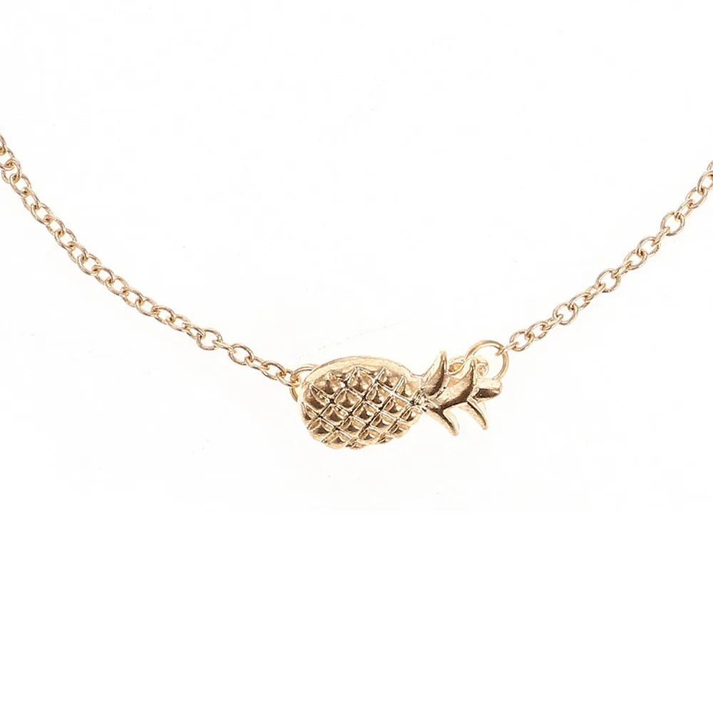 Gold or silver alloy bracelet featuring a pineapple charm, from the XINGX women's jewellery series.