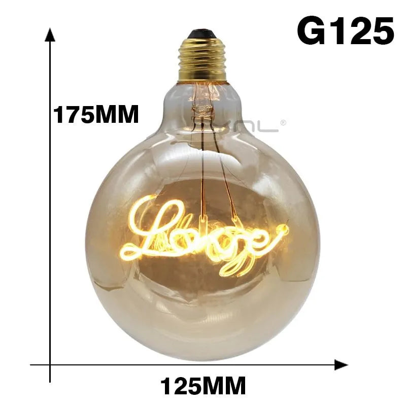 Yellow LOVE letter lamp with glass lampshade emitting warm light, 125x175mm on a tabletop