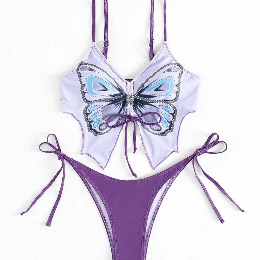 Women's purple bow ins style split bikini suit top and briefs on a mannequin.