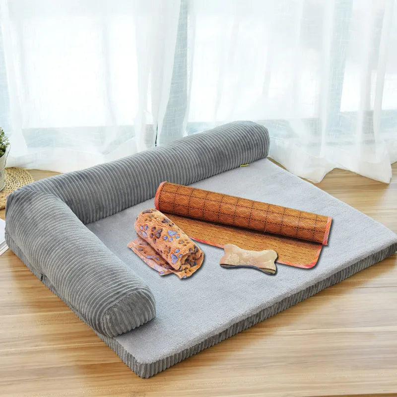 Corduroy dog sofa bed with bolster sides on a wooden floor, showing grey colour option in large size.