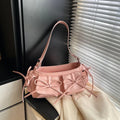 Women's large shoulder bag with bow and tassel decoration, showing multi-pocket sandwich pocket design.