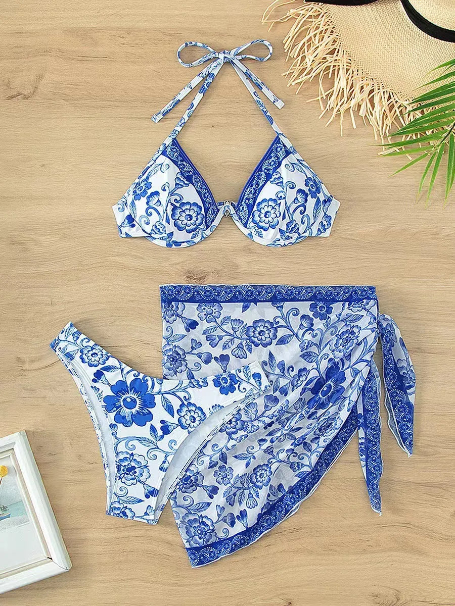 Blue and white porcelain striped printed bikini set with adjustable lace up detail on a woman at the beach