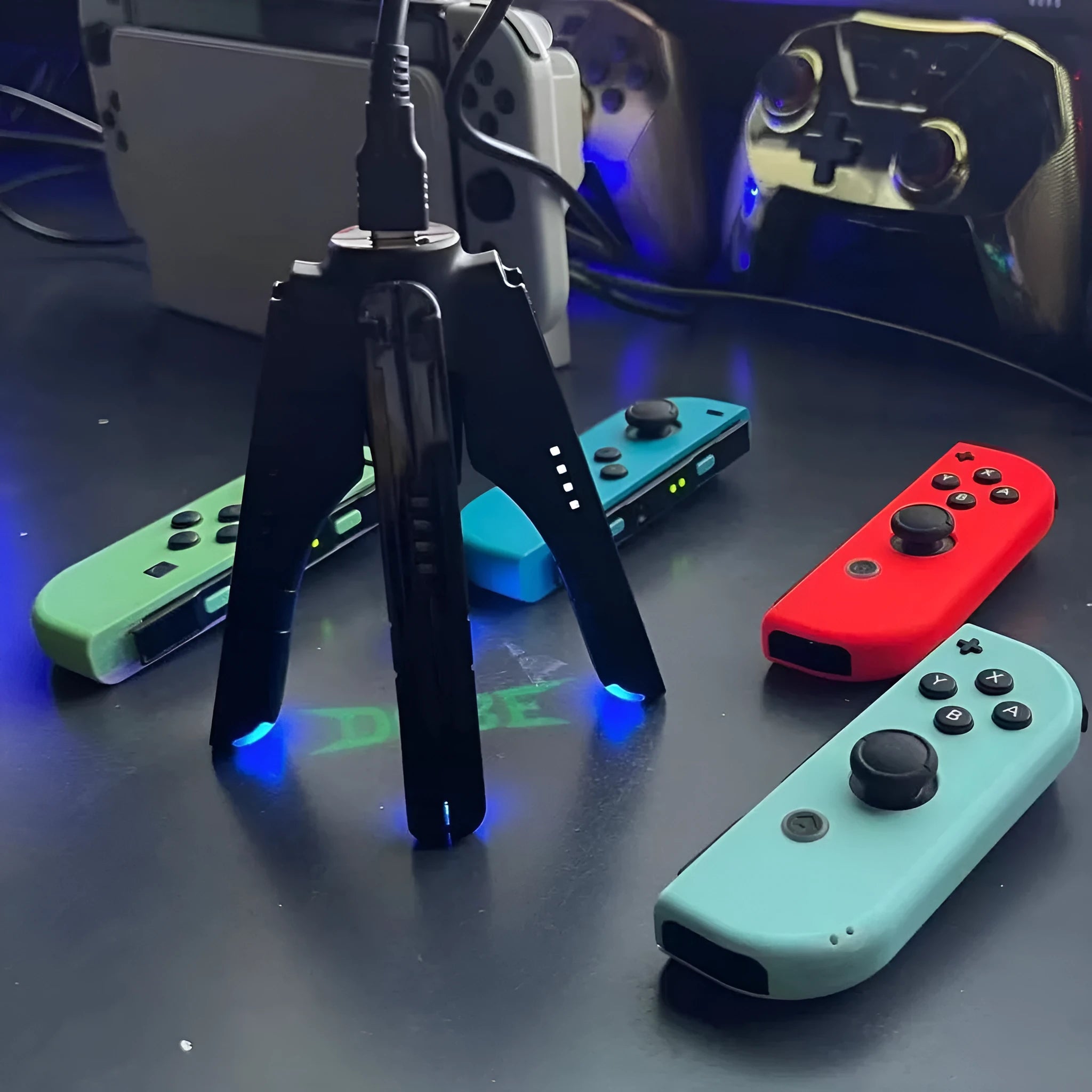 Black four-in-one charger holder for Switch, attached to handle ends with Type-C interface.