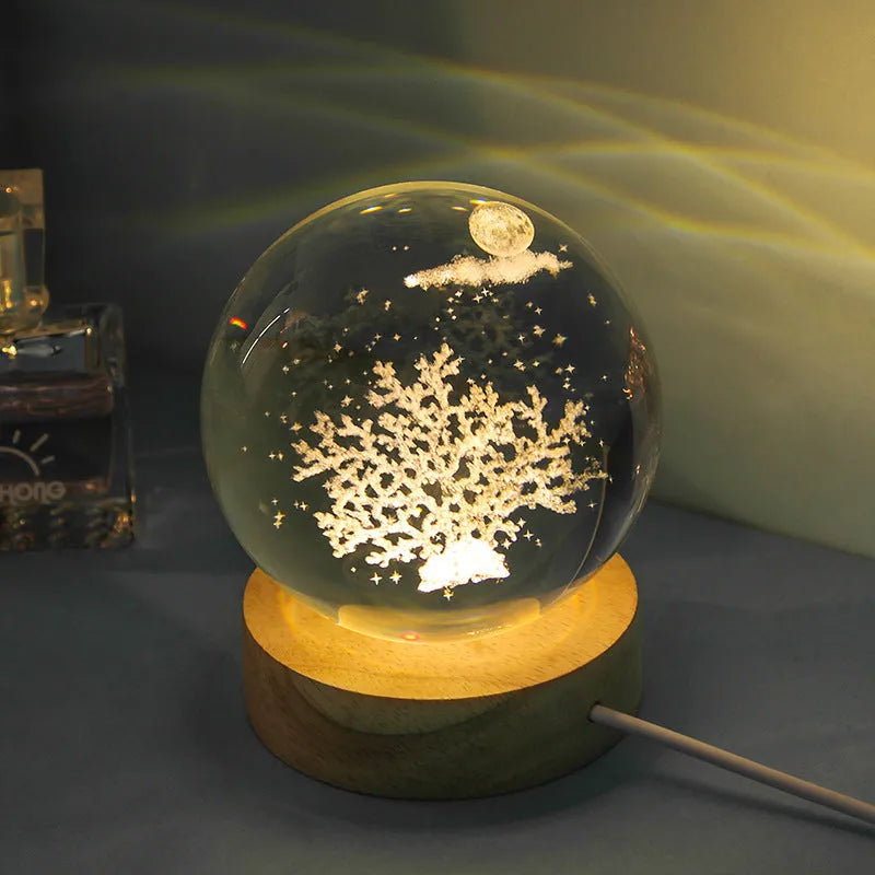 Transparent crystal ball night lamp with 3D carved jellyfish design, on a round base with USB cable.