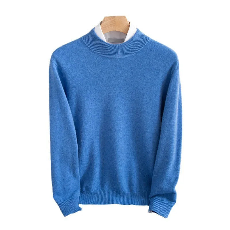 Man wearing a loose fit half-turtleneck wool sweater in a camel colour.