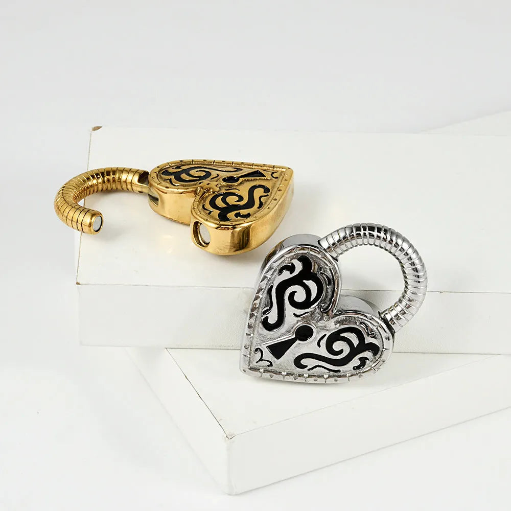 Women's heart-shaped stainless steel ear piercing earrings in gold or steel colour