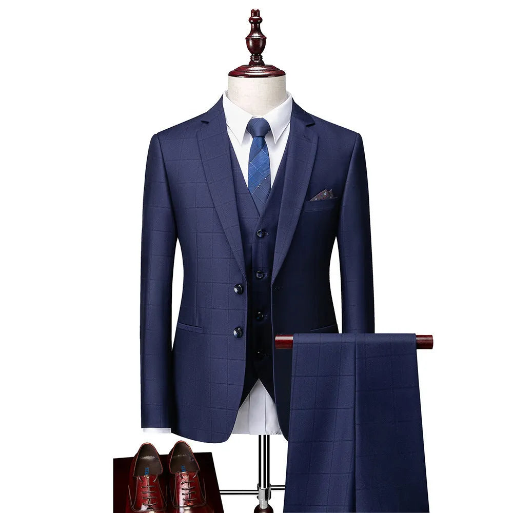 Men's navy blue plaid slim fit three-piece suit with jacket, vest, and trousers on a hanger