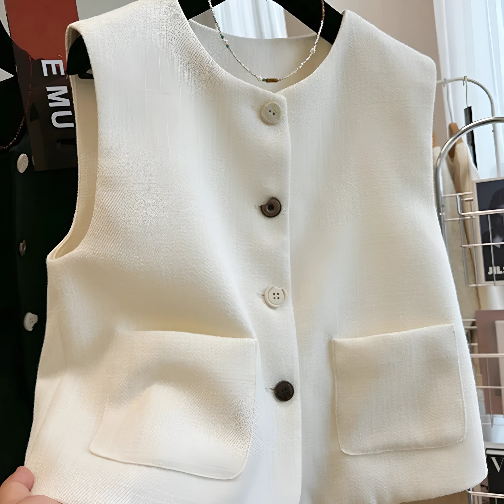 Women's sleeveless bandage dress vest in polyester with round neck, shown in milky white and black colours