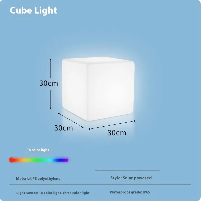 White square LED cube light stool on grass, showing modern design and waterproof build for outdoor use.