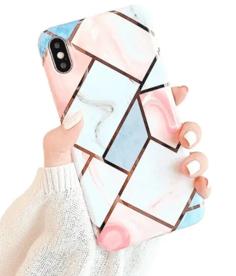 Flexible silicone gel mobile phone case for various iPhone models on a table.