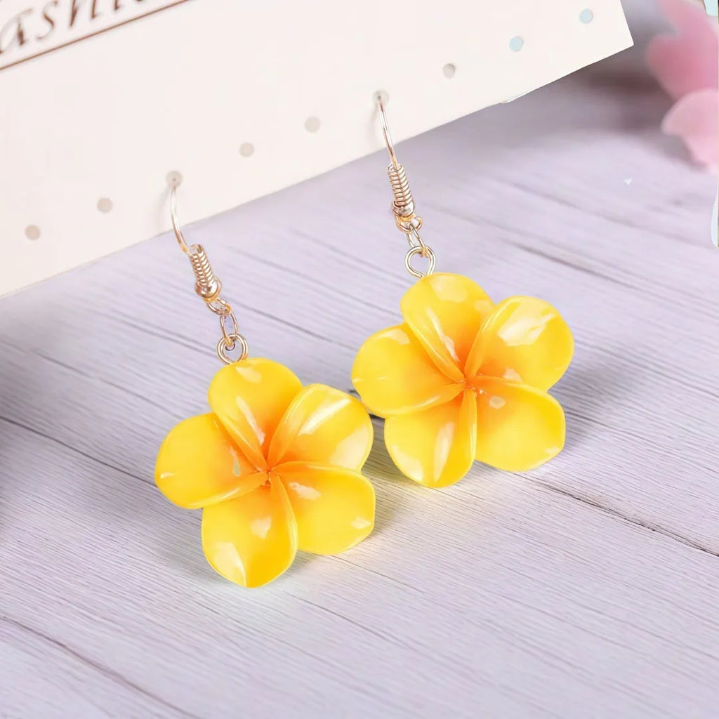 Handmade resin Plumeria Rubra earrings in seven colours including pink, blue, purple, white, green, yellow, and rose red