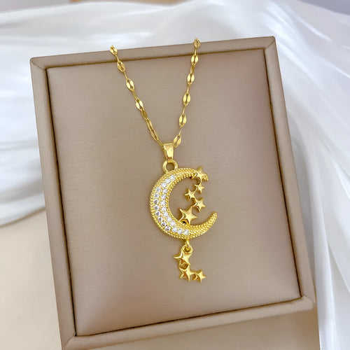 A218 geometric moon pendant necklace with diamond-cut facets and a dangling tassel on a silver chain.