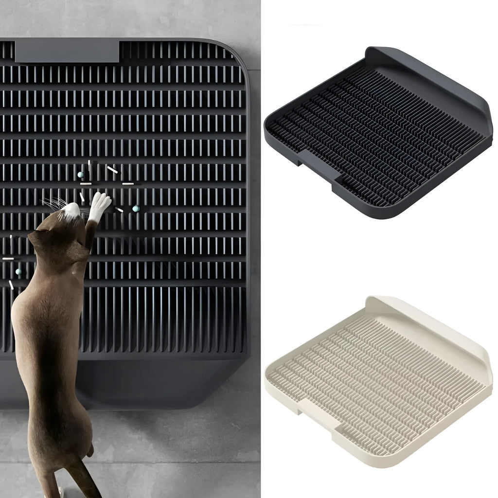 Large black cat litter pedal mat with slanted design next to a litter box.