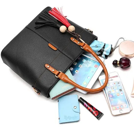 Women's PU leather crossbody shoulder bag in Black with silver-tone clasp, worn over shoulder