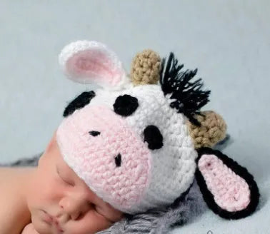 White hand-knitted baby cow suit set with hat and pants made from wool cotton blend