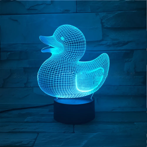 3D yellow duck shaped LED night light with remote control on a table