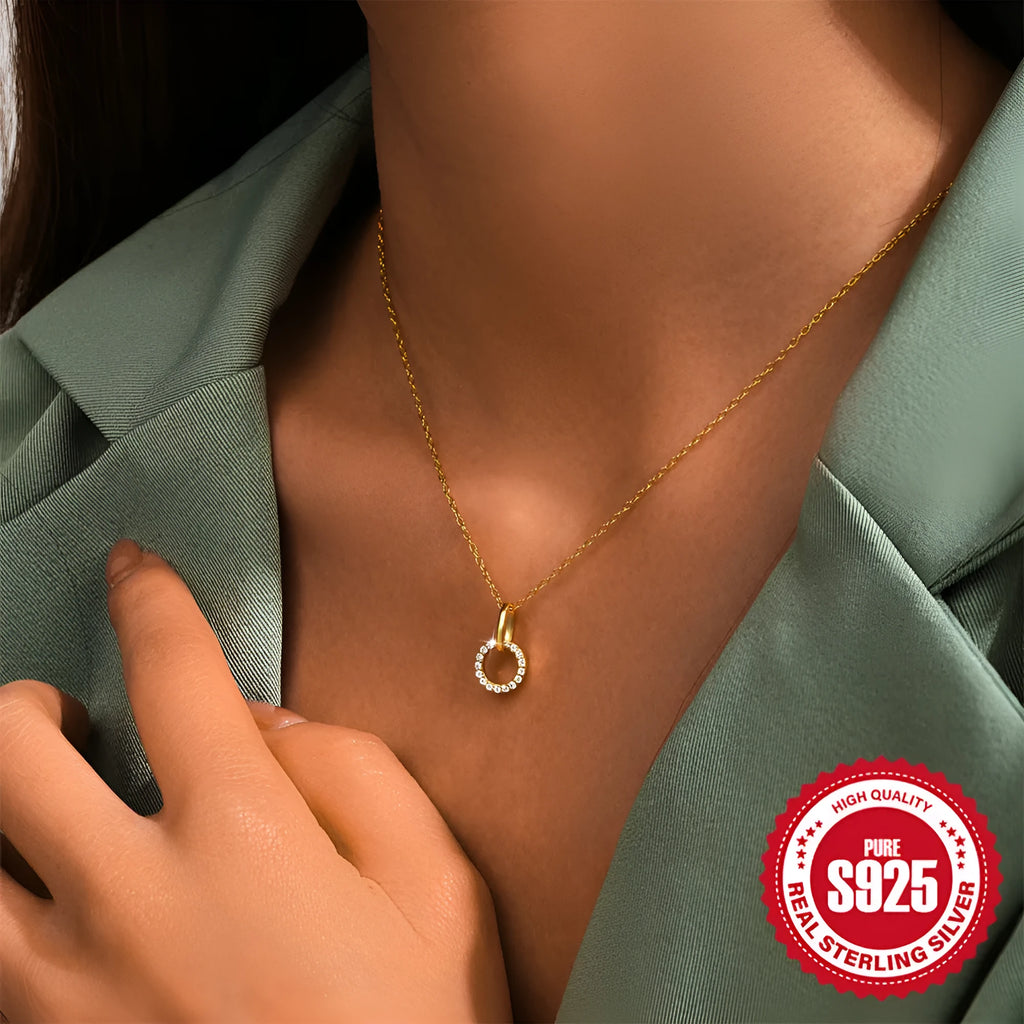 Gold-coloured geometric sterling silver pendant necklace with zircon detail on an adjustable chain.