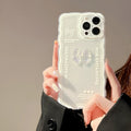 Clear iPhone case with a raised ice bow design, shown next to a white phone lanyard.
