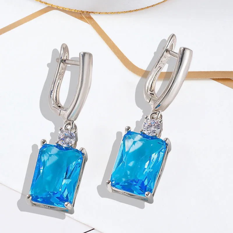 Square quadrilateral geometry earrings with electroplated gold or silver finish on copper construction