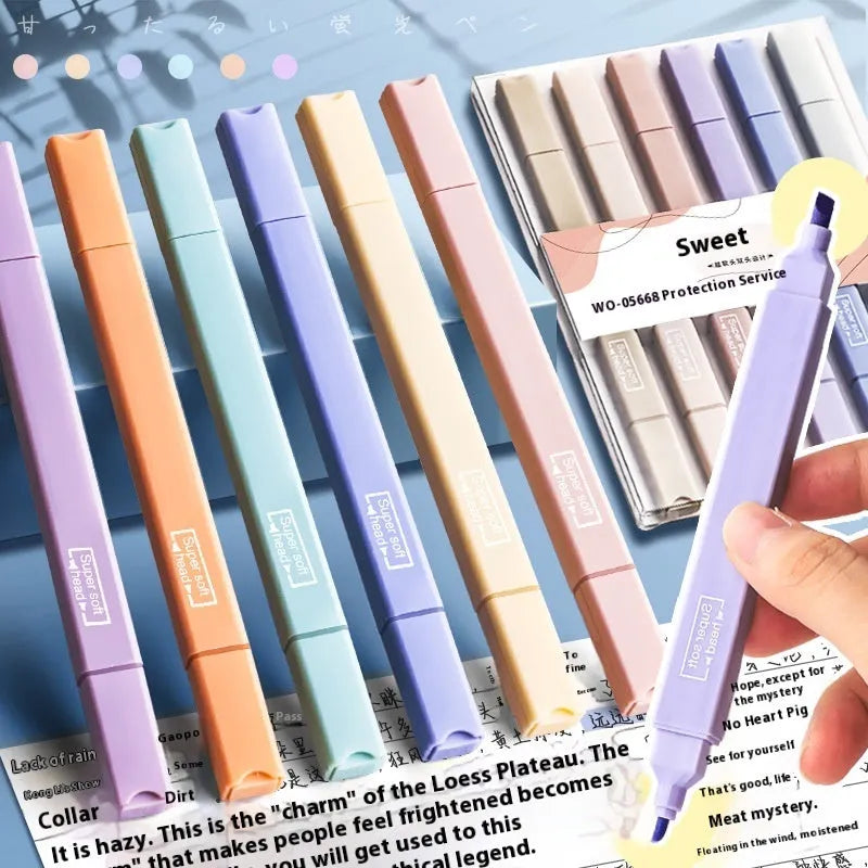 Set of double-ended fluorescent highlighting pens in mixed colours on a white background.