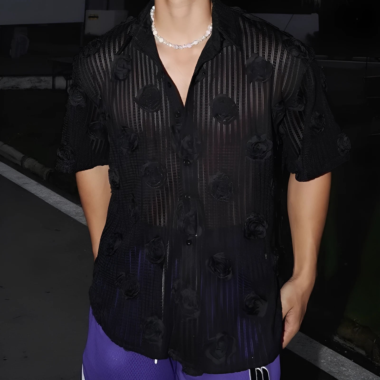 Man's loose-fit short-sleeve shirt with a white and black three-dimensional floral print on heavyweight fabric.
