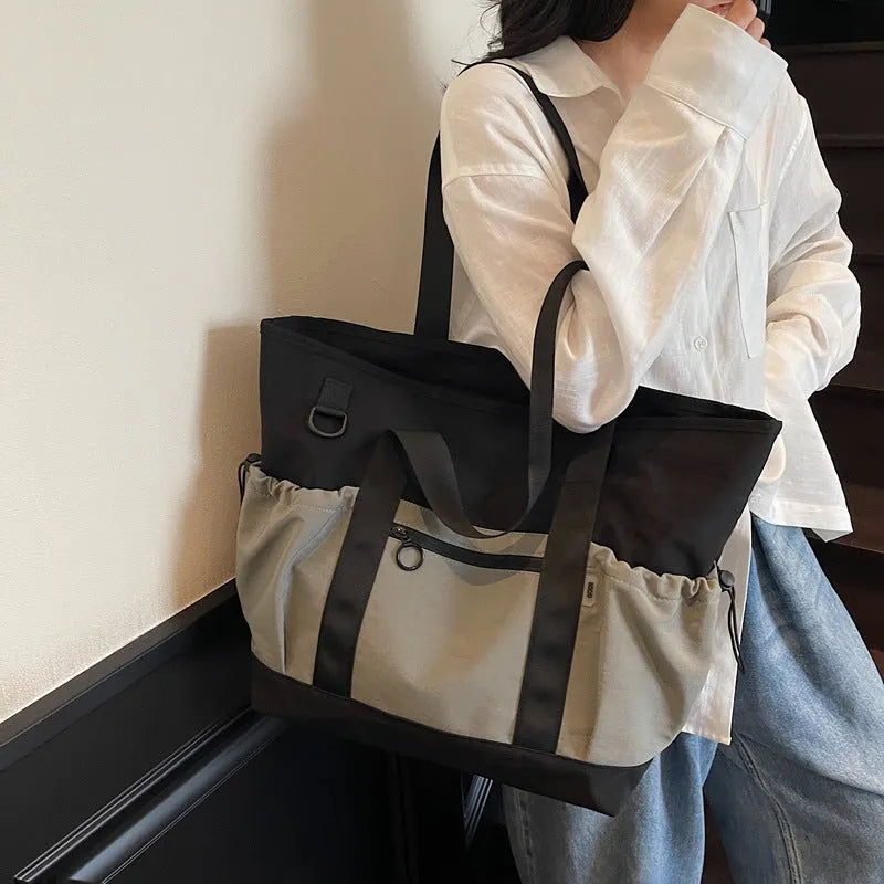 Women's Oxford travel bag in grey with 36-55L capacity and letter pattern
